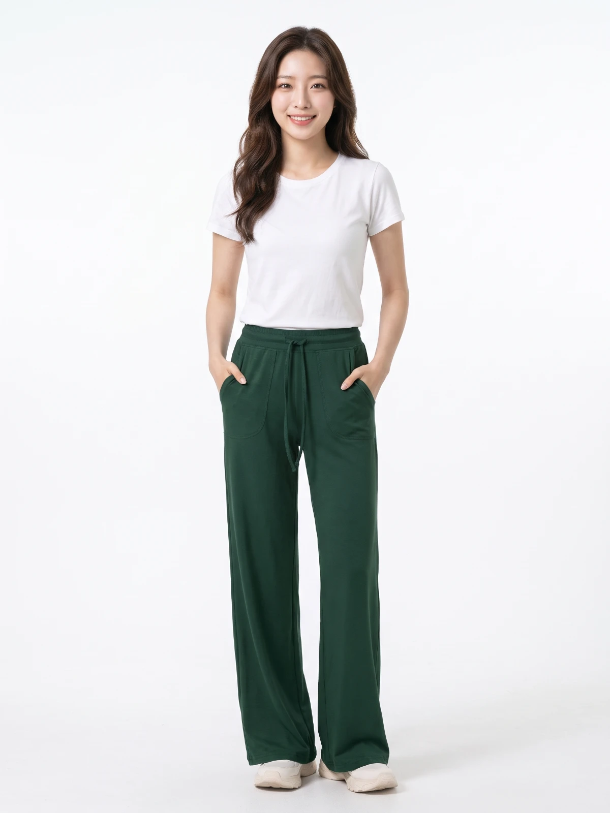 Model wearing dark green wide-leg yoga pants with hands in pockets